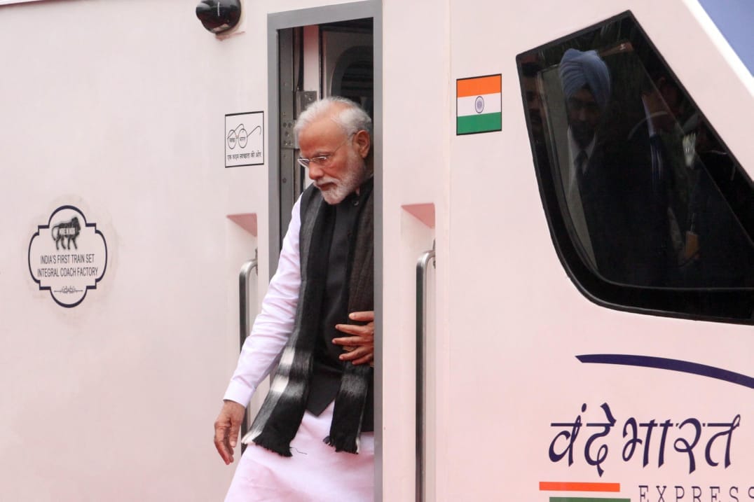 Prime minister Narendra Modi emerges from Train 18 after a tour