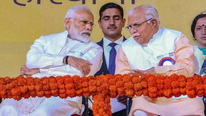 PM Narendra Modi speaks with Haryana CM Manohar Lal Khattar during the launch of 'Swachh Shakti 2019 programme' in Kurukshetra