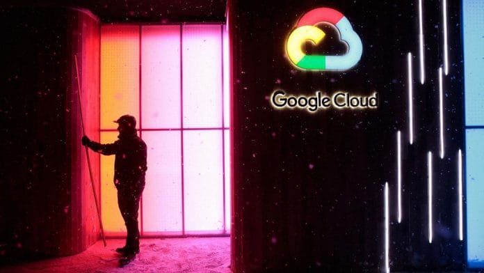 A worker stands by a Google Inc. 'Google Cloud' pop-up space in Davos, Switzerland| Jason Alden/Bloomberg