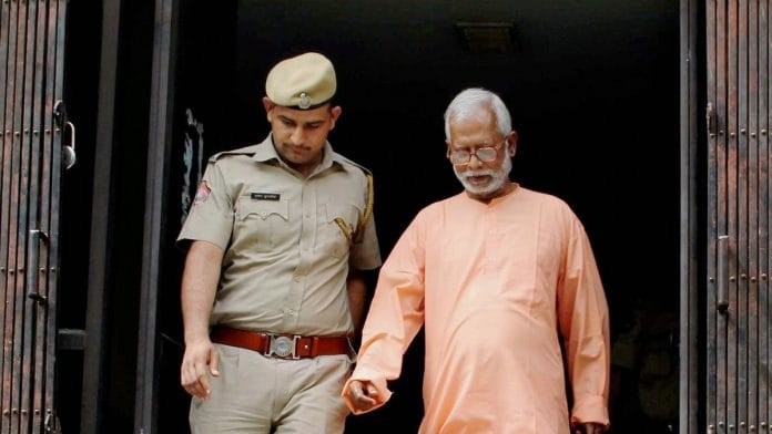 File photo of Aseemanand being escorted by police personnel | PTI
