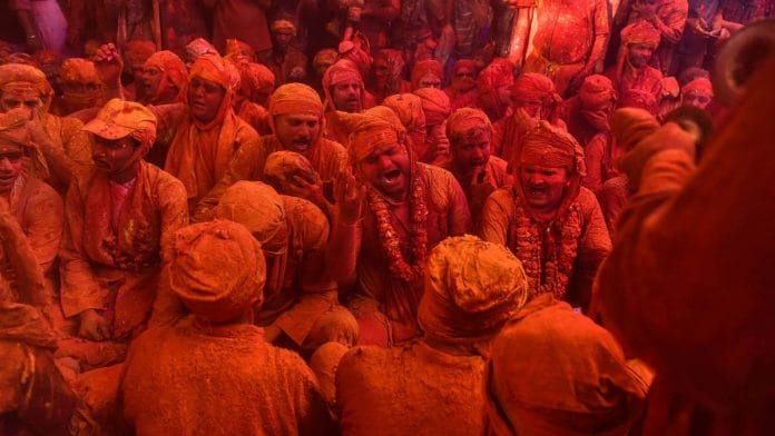People play Holi in Barsana, Mathura