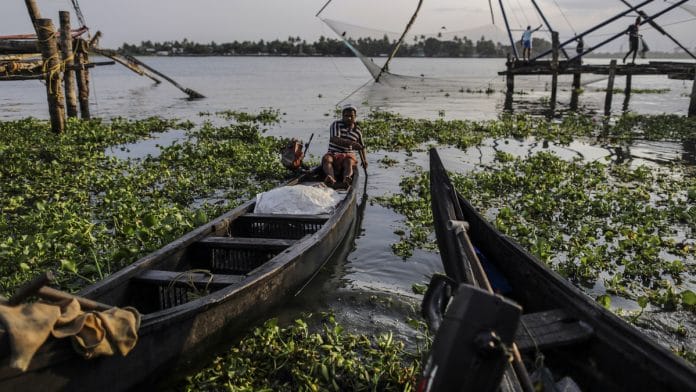 A fisherman in Cochin, Kerala | Dhiraj Singh/Bloomberg