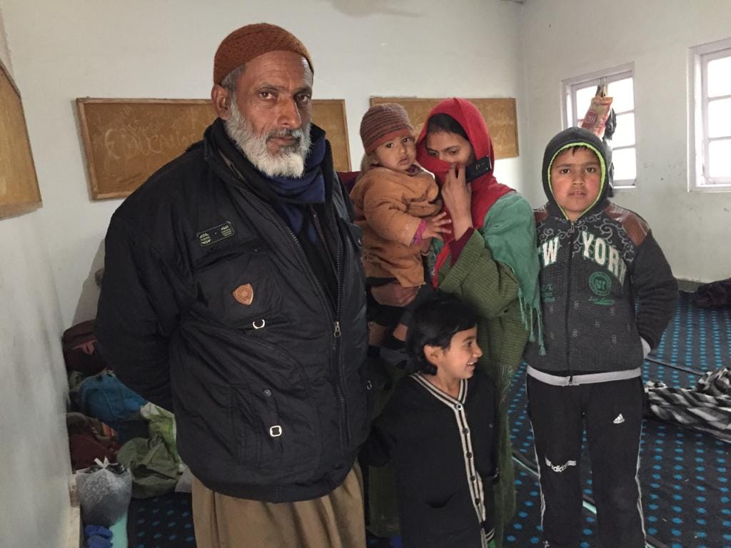 60-year-old Mohd. Rafiq with his family at the shelter | Moushumi Das Gupta/ThePrint