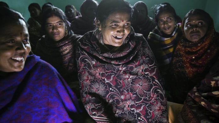 Rita Devi (center) attends a Aajeevika project meeting