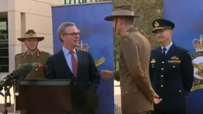 Australian defence minister Christopher Pyne (L) and defence chief Angus Campbell at the press conference