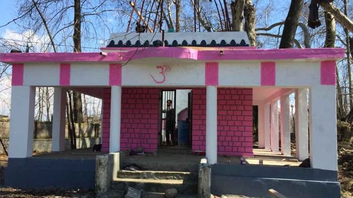 A painter at work inside the Shiv temple in Achan, Pulwama | Moushumi Das Gupta/ThePrint