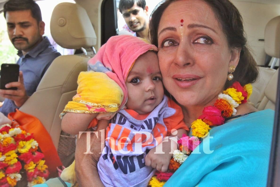 Hema Malini holds a villagers baby | Praveen Jain/ ThePrint