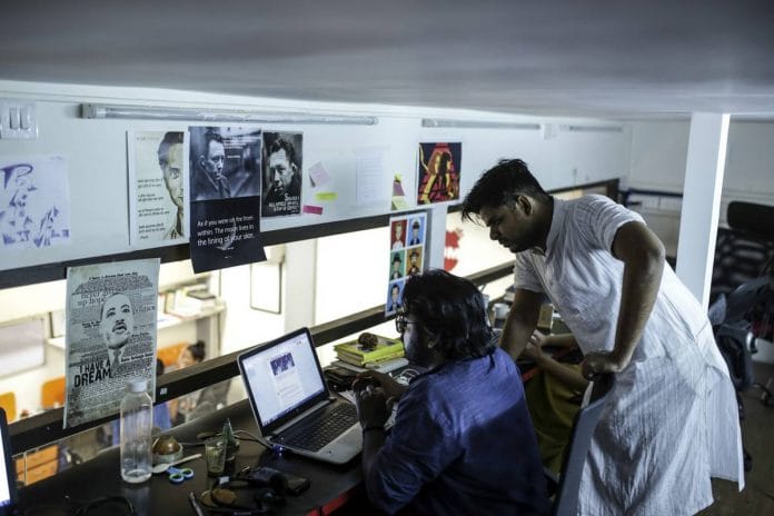 Employees work at Boom's office