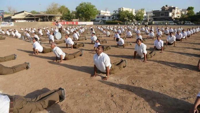 Members of Rashtriya Swayamsevak Sangh (RSS) take part in a drill marking the Hindu New Year in Ahmedabad