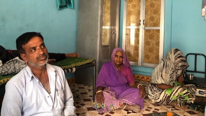 Jagdish Thakur, who lost his brother Kanhaiya Lal in police firing during the 2017 Mandsaur farmer protests, with his mother and Kanhaiya’s wife