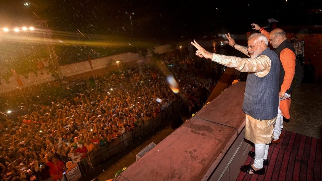 BJP workers welcome Narendra Modi and Amit Shah at the party headquarters, Thursday | PTI