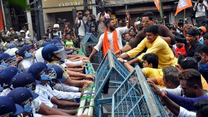 BJP supporters clash with police during a protest in Kolkata. | ANI Photos