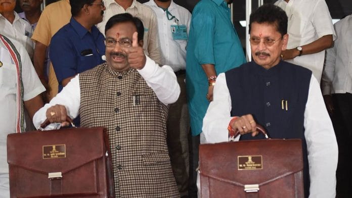 Maharashtra Finance Minister Sudhir Mungantiwar and Minister of State for Home Deepak Kesarka arrive at the Maharashtra Assembly to present budget