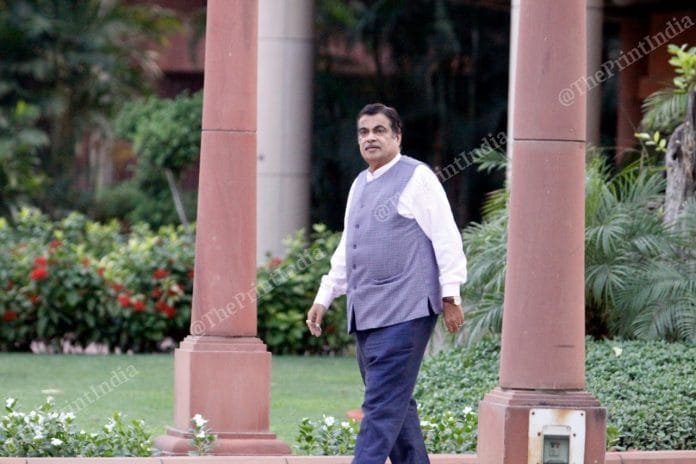 Nitin Gadkari walks towards his car