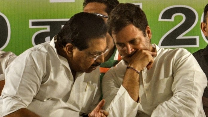 Congress president in a conversation with PC Chacko during an election rally at Ramleela Maidan in New Delhi. | ANI Photo