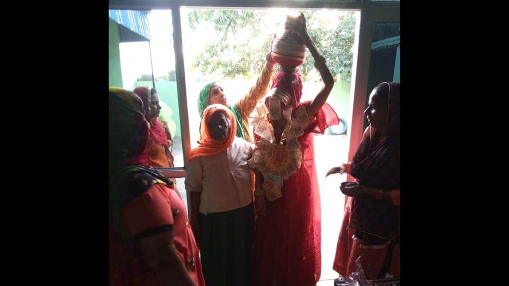 Women performing a ritual at a well. | Photo: Jyoti Yadav | ThePrint