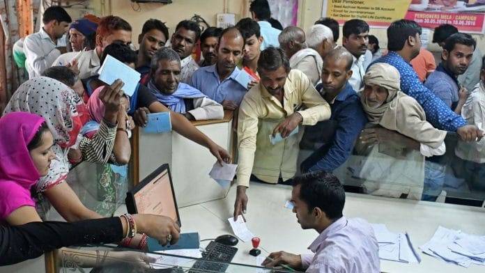 Villagers of Chithra village, Dadri queue inside a bank to exchange old currency notes at Dadri, Uttar Pradesh on the outskirts of New Delhi, India, 15 November 2016. Photographer : Anindito Mukherjee | Bloomberg