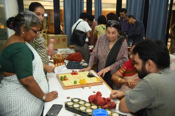 People check out Ashta Chemma board game at Playing with the Past. | INSTUCEN