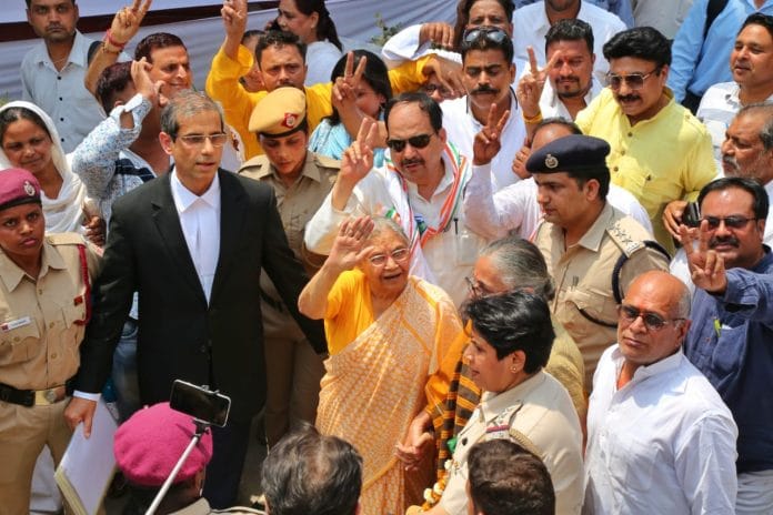 Sheila Dikshit waves to supporters as she goes to file her nomination papers for the 2019 Lok Sabha elections | Photo: Suraj Singh Bisht | ThePrint