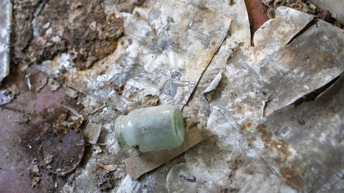 Decaying personal items sit on the floor of a house abandoned following the Chernobyl nuclear reactor meltdown | Photographer: Vincent Mundy | Bloomberg