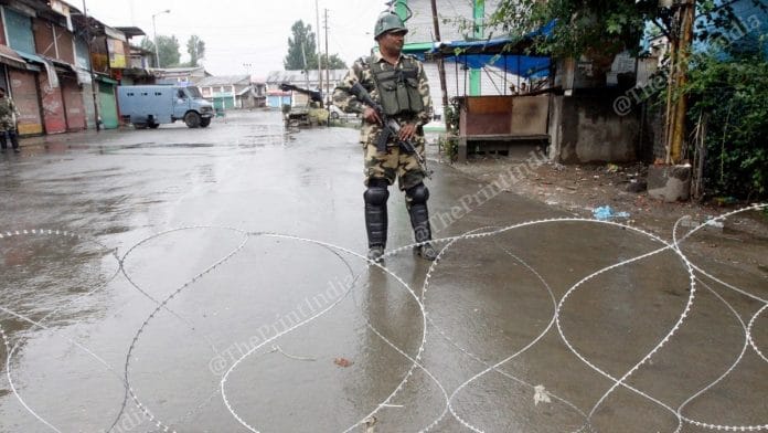 A security force officer stands guard in Kashmir | Photo: Praveen Jain | ThePrint