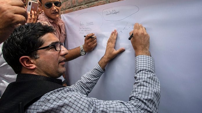 Shah Faesal signing petition