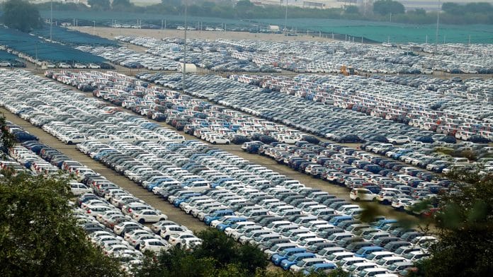 Newly manufactured Maruti Suzuki cars are seen parked inside the company factory in Manesar near Gurugram
