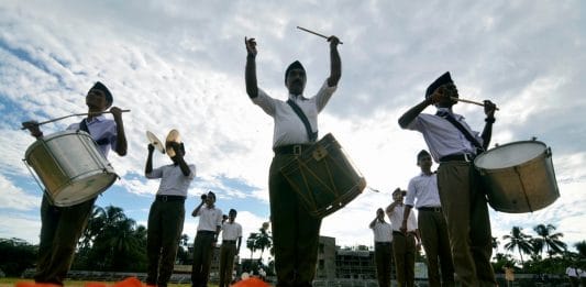 RSS members participate in a parade in Dharmanagar on 28 September | PTI Photo