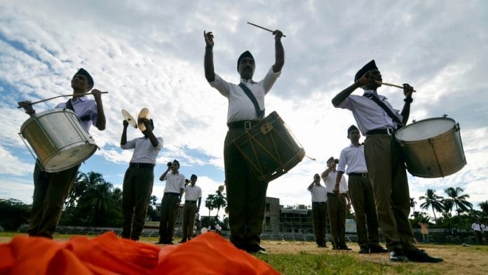 RSS members participate in a parade in Dharmanagar on 28 September | PTI Photo