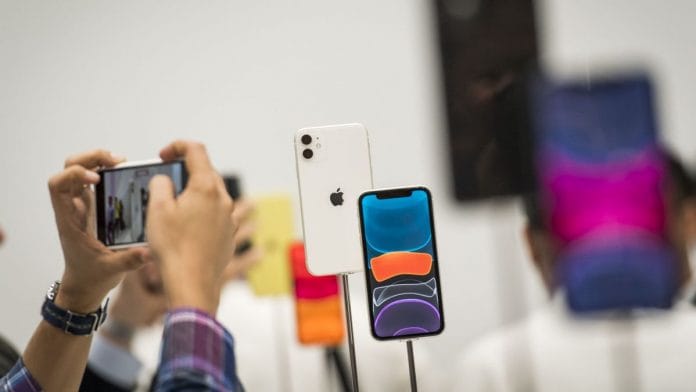 Attendees view the Apple Inc. iPhone 11 after an event in Cupertino, California, U.S. | Photographer: David Paul Morris | Bloomberg