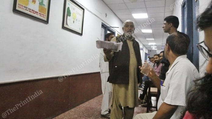 Gulham Mohammad Ganai waits outside the office of the Secretary of Rural Development and Panchayati Raj in Kashmir. | Photo: Praveen Jain | ThePrint