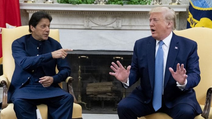 US President Donald J. Trump (R) and Prime Minister of Pakistan Imran Khan (L) deliver remarks to members of the news media, during their meeting in the Oval Office of the White House on 22 July 2019. | Bloomberg