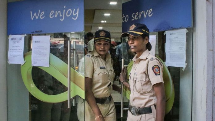 Police personnel stand guard outside Punjab and Maharashtra Cooperative Bank (PMC) at GTB Nagar in Mumbai | PTI file photo