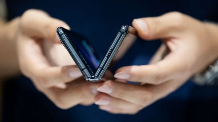 A customer tries out a Samsung Electronics Co. Galaxy Fold smartphone at the company's D'light flagship store in Seoul, South Korea on 6 September