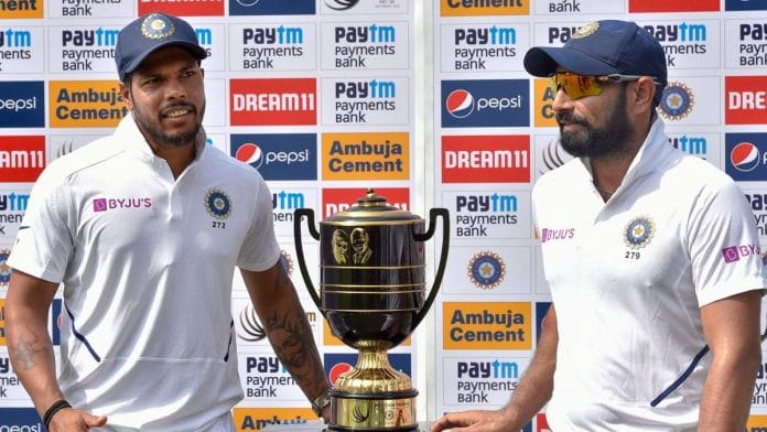 Umesh Yadav and Mohammed Shami with the Gandhi-Mandela Trophy