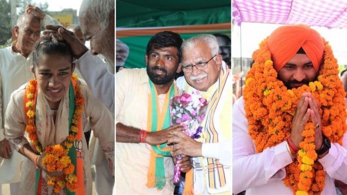 Babita Phogat (L), Yogeshwar Dutt (C), and Sandeep Singh (R)