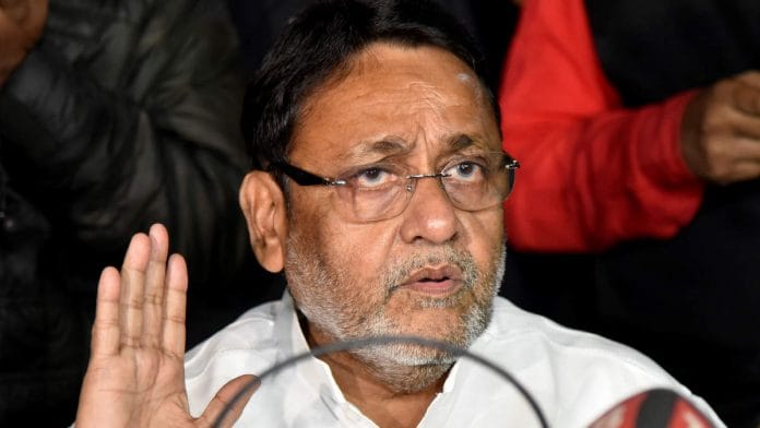 NCP leader Nawab Malik addressing a press conference