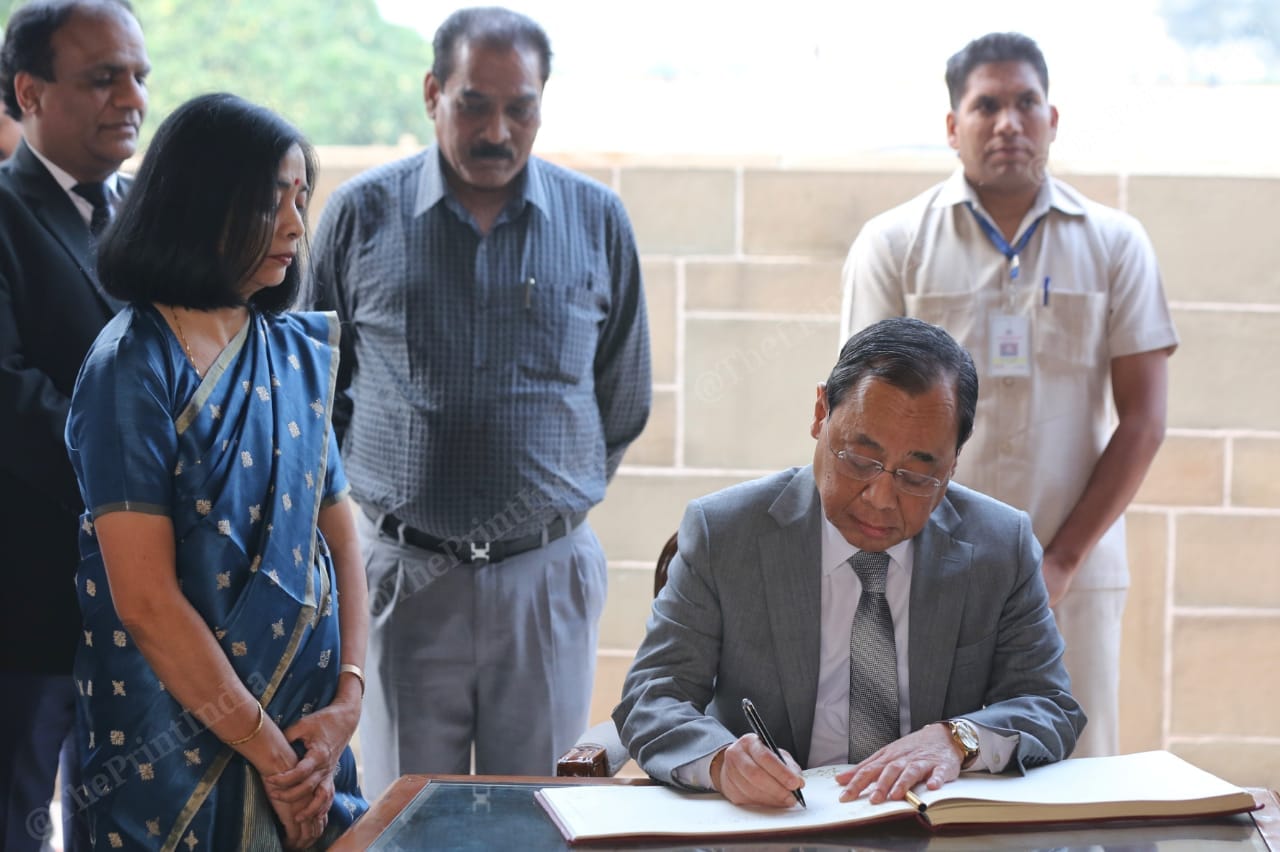 CJI Ranjan Gogoi writes his remarks in the visitors' book at Raj Ghat | Photo: Suraj Singh Bisht | ThePrint