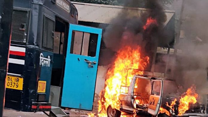 A vehicle set ablaze as a scuffle broke out between Delhi Police and lawyers at Tis Hazari court, in New Delhi | ANI