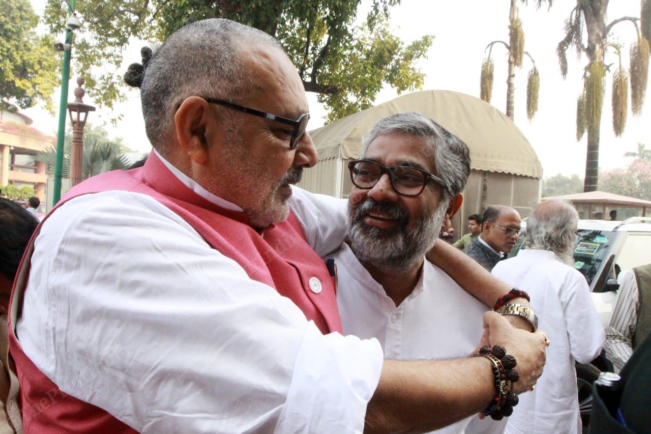 Minister of Animal Husbandry, Dairying and Fisheries Giriraj Singh hugs BJP leader Neeraj Shekhar