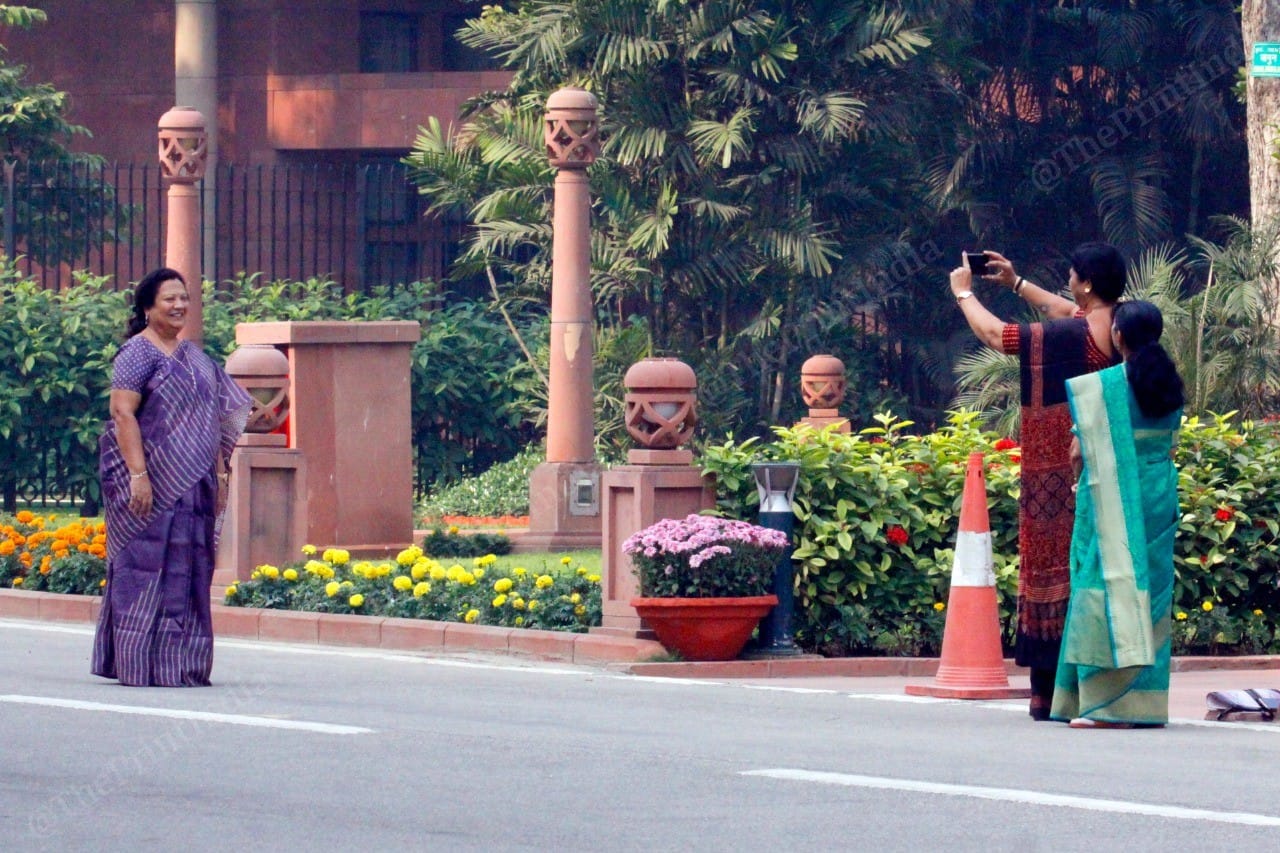 MPs from Gujarat, Ranjanben Dhananjay Bhatt (red saree), Bharati Dhirubhai Shyal (green saree), and Darshana Vikram Jardosh (Purple saree) click pictures outside Parliament house