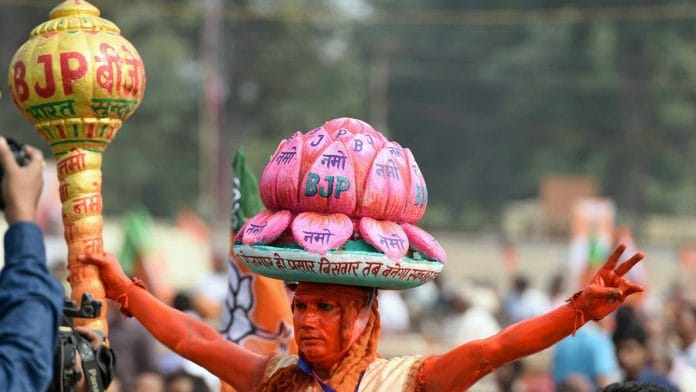 A BJP supporter during Prime Minister Narendra Modi's campaign rally ahead of the first phase of Jharkhand Assembly elections. | ANI