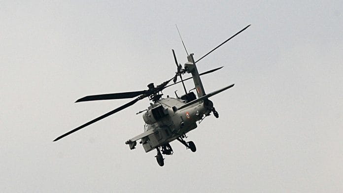 US-made Apache AH-64E attack helicopter flies during its induction ceremony into the Indian Air Force, at Airforce Station in Pathankot | ANI
