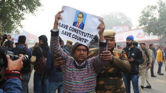 Police take away a protester during an anti-citizenship law rally inNew Delhi on 19 December 2019 | Suraj Singh Bisht | ThePrint