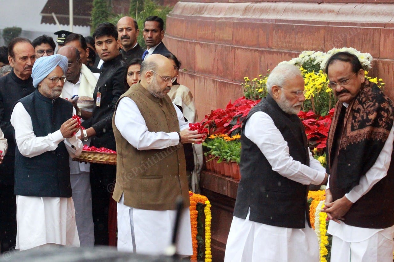 Rajya Sabha Chairman Naidu removed his cap before paying tribute as a mark of respect | Photo: Praveen Jain | ThePrint