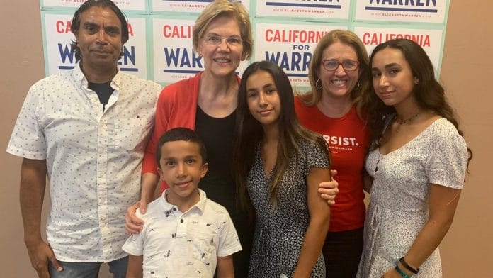 Sushil Tyagi (far-left) with Democrat Senator Elizabeth Warren. Warren's daughter Amelia is also seen, along with her and Sushil's three children