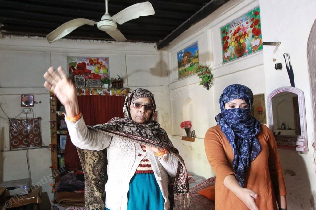 Mother and sister of Javed Ansari, who was arrested by the police, showing their 'vandalised' house | Photo: Praveen Jain | ThePrint