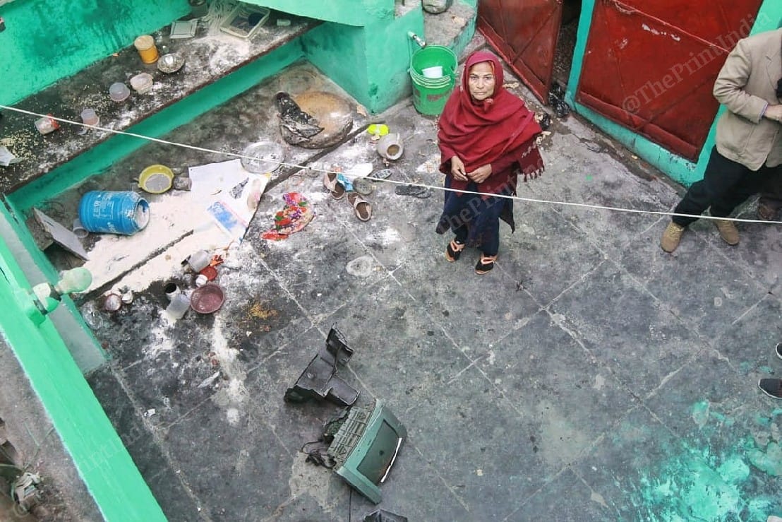 Zareena Khatoon shows the damage inflicted on her home as her son Qamar Ahmed was being arrested | Photo: Praveen Jain | ThePrint