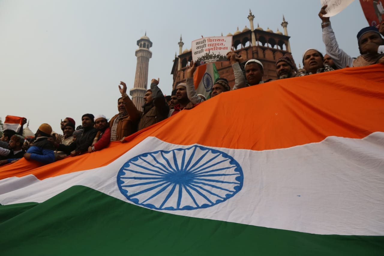 Protestors with the Indian tricolour at Jama Masjid | Photo: Manisha Mondal | ThePrint