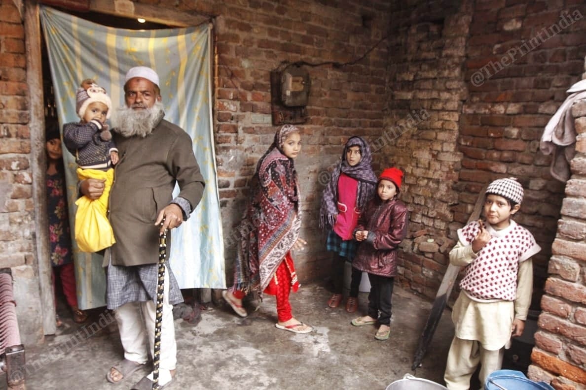 Man standing with his grand-daughter